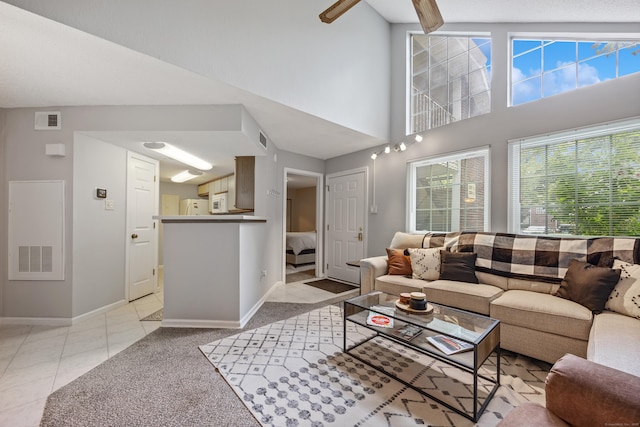 289 Carriage Crossing Ln Unit 289, Middletown, CT 06457 - living room featuring light carpet, light tile patterned flooring, and a high ceiling