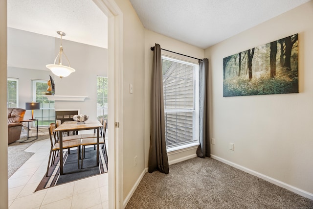 289 Carriage Crossing Ln Unit 289, Middletown, CT 06457 - dining room featuring a textured ceiling and light carpet