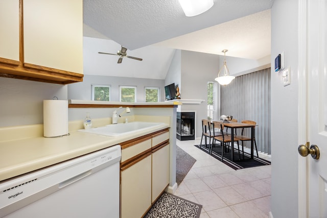 289 Carriage Crossing Ln Unit 289, Middletown, CT 06457 - kitchen featuring white dishwasher, a fireplace, vaulted ceiling, ceiling fan, and light tile patterned floors