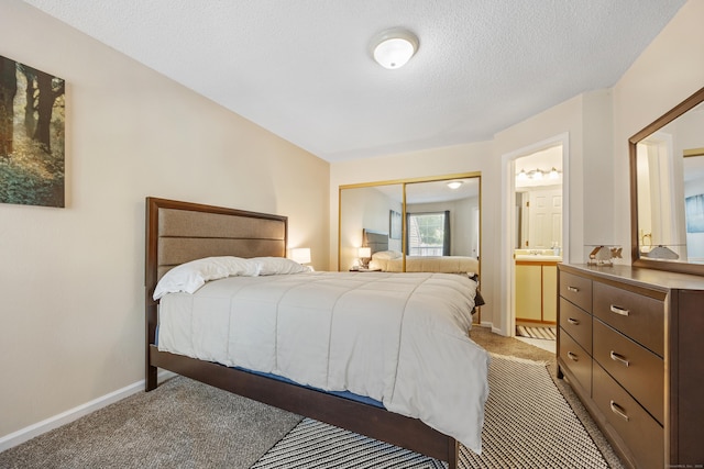 289 Carriage Crossing Ln Unit 289, Middletown, CT 06457 - bedroom with light carpet, a closet, ensuite bathroom, and a textured ceiling