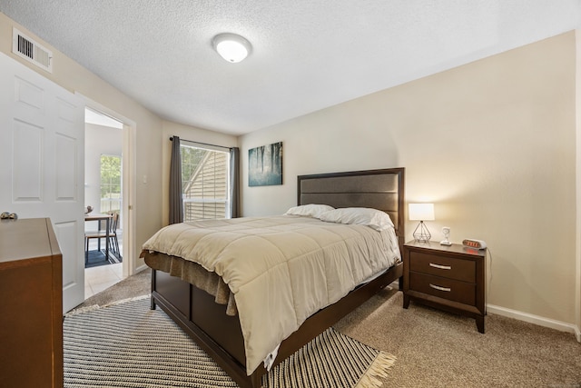 289 Carriage Crossing Ln Unit 289, Middletown, CT 06457 - bedroom featuring light carpet and a textured ceiling