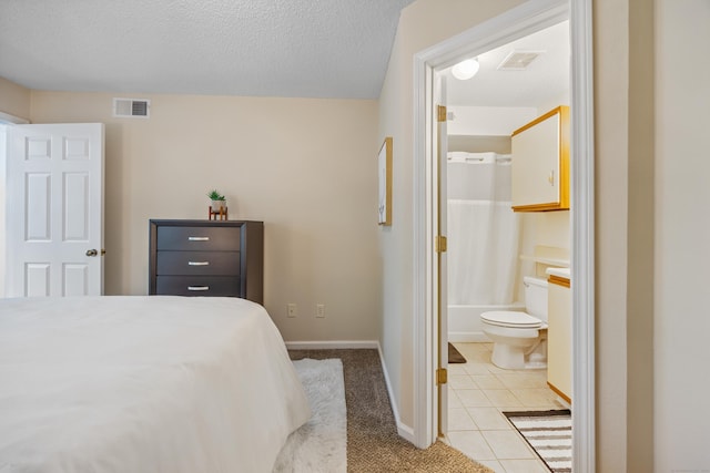 289 Carriage Crossing Ln Unit 289, Middletown, CT 06457 - bedroom with light tile patterned floors and ensuite bathroom