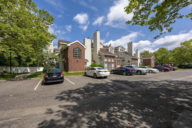 289 Carriage Crossing Ln Unit 289, Middletown, CT 06457 - uncovered parking lot featuring a residential view