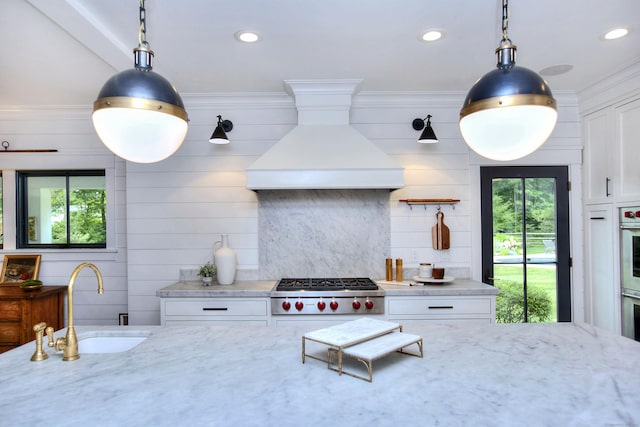 229 Good Hill Rd, Weston, CT 06883 - kitchen with stainless steel appliances, healthy amount of natural light, premium range hood, white cabinetry, and recessed lighting