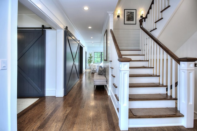 229 Good Hill Rd, Weston, CT 06883 - staircase featuring a barn door, wood finished floors, recessed lighting, and crown molding