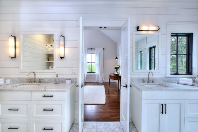 229 Good Hill Rd, Weston, CT 06883 - bathroom with two vanities, wood walls, and lofted ceiling