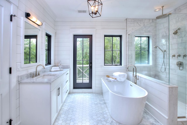229 Good Hill Rd, Weston, CT 06883 - bathroom with a tile shower, double vanity, a freestanding bath, and crown molding