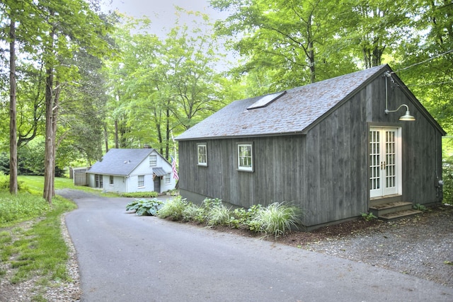 229 Good Hill Rd, Weston, CT 06883 - view of side of property featuring french doors and an outbuilding