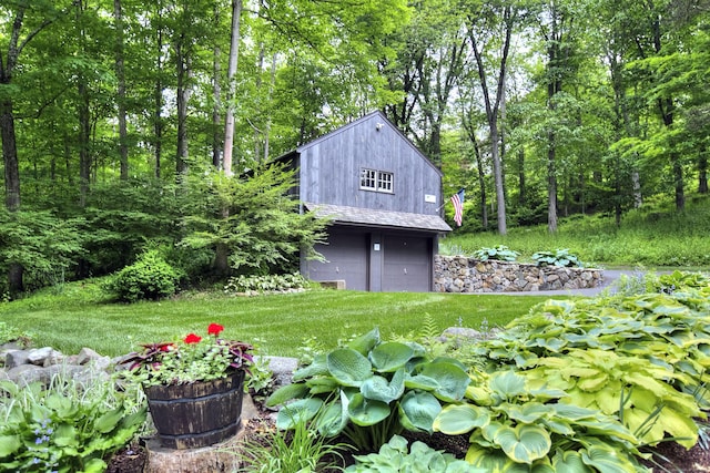 229 Good Hill Rd, Weston, CT 06883 - view of yard with a garage, an outbuilding, and a view of trees