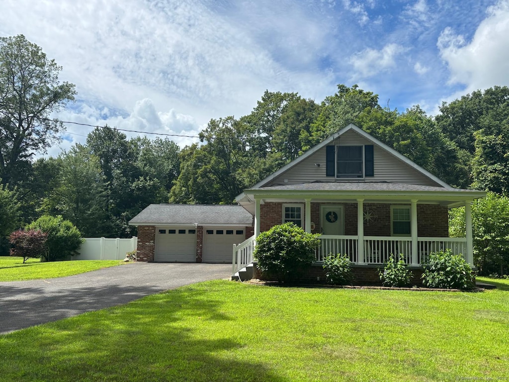 225 Whittemore Rd, Middlebury, CT 06762 - view of front of property featuring driveway, covered porch, and brick siding