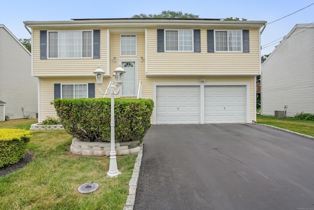 4 Russo Ter, New Haven, CT 06513 - bi-level home with a garage, driveway, and a front yard