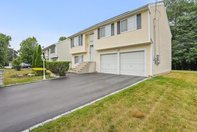 4 Russo Ter, New Haven, CT 06513 - bi-level home featuring an attached garage, asphalt driveway, and a front yard