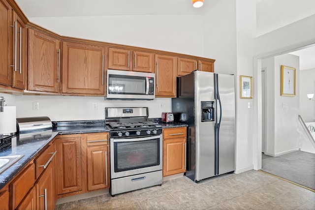 4 Russo Ter, New Haven, CT 06513 - kitchen featuring stainless steel appliances, dark countertops, brown cabinets, and high vaulted ceiling