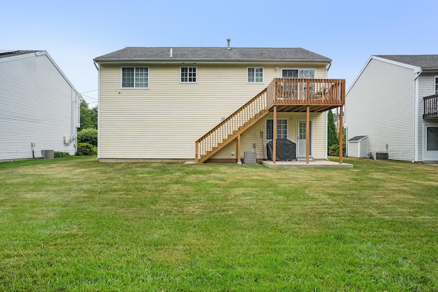 4 Russo Ter, New Haven, CT 06513 - back of property with a wooden deck, a patio area, a lawn, and stairway