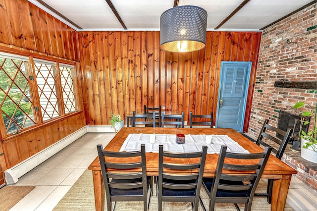 93 Glenrock Rd, Waterbury, CT 06706 - dining room featuring a baseboard heating unit, tile patterned floors, and wood walls