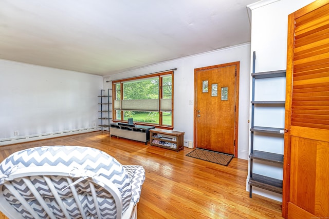 93 Glenrock Rd, Waterbury, CT 06706 - living area with light wood-style floors, a baseboard radiator, and a baseboard heating unit