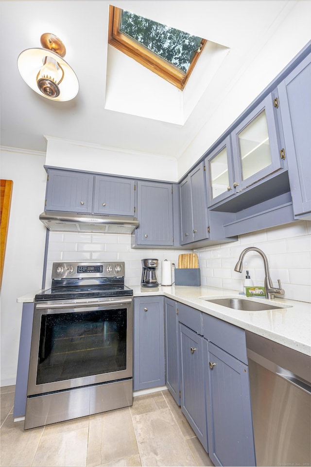 93 Glenrock Rd, Waterbury, CT 06706 - kitchen with stainless steel appliances, a skylight, decorative backsplash, gray cabinets, and crown molding
