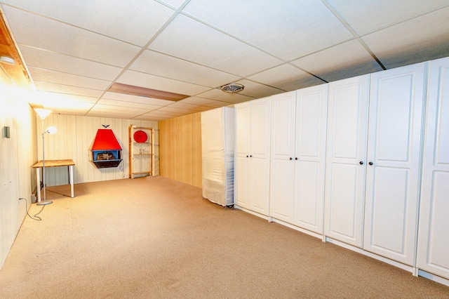 93 Glenrock Rd, Waterbury, CT 06706 - basement featuring light colored carpet, a paneled ceiling, and wood walls