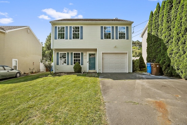 75 Beecher Ave, Shelton, CT 06484 - view of front facade with asphalt driveway, a front yard, and an attached garage