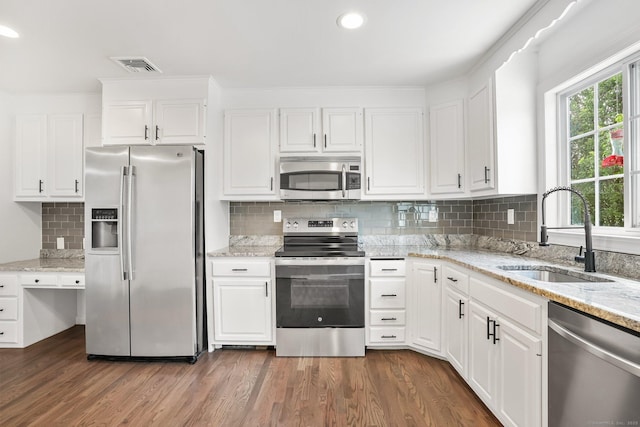 75 Beecher Ave, Shelton, CT 06484 - kitchen featuring stainless steel appliances, white cabinetry, tasteful backsplash, dark wood-style floors, and recessed lighting