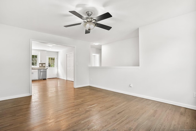 75 Beecher Ave, Shelton, CT 06484 - unfurnished living room with wood finished floors and ceiling fan