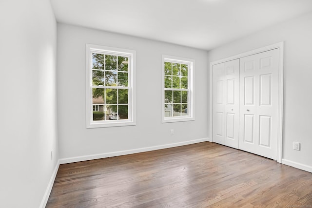 75 Beecher Ave, Shelton, CT 06484 - unfurnished bedroom featuring wood finished floors and a closet
