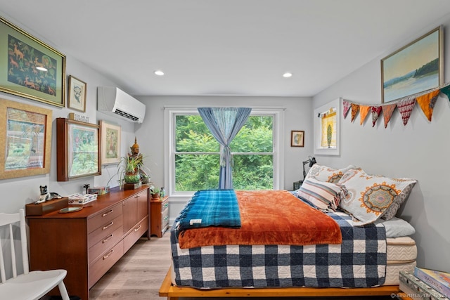 20 Meadow Woods Rd, Essex, CT 06426 - bedroom with a wall mounted air conditioner, light wood-type flooring, and recessed lighting