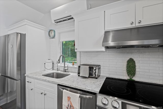 20 Meadow Woods Rd, Essex, CT 06426 - kitchen featuring stainless steel appliances, backsplash, white cabinets, and light stone counters