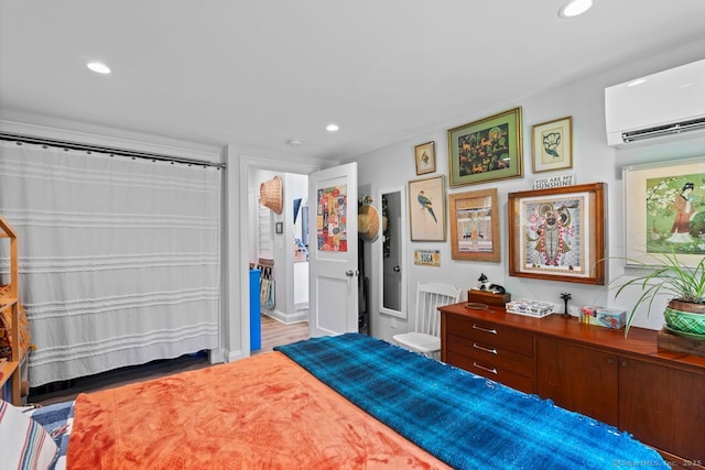 20 Meadow Woods Rd, Essex, CT 06426 - bedroom with a wall unit AC, recessed lighting, and wood finished floors