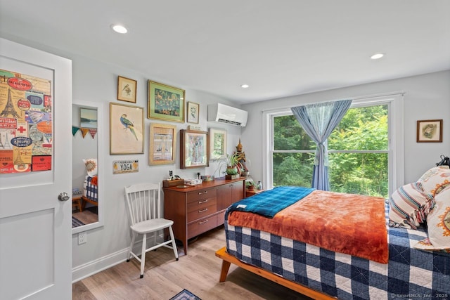 20 Meadow Woods Rd, Essex, CT 06426 - bedroom with a wall mounted AC, light wood-style floors, and recessed lighting