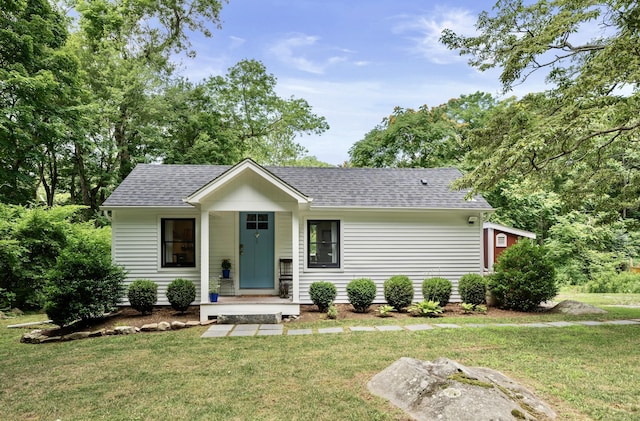 20 Meadow Woods Rd, Essex, CT 06426 - single story home with roof with shingles and a front yard