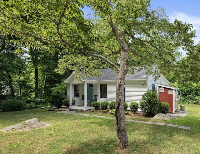 20 Meadow Woods Rd, Essex, CT 06426 - view of front of home with a shingled roof and a front lawn