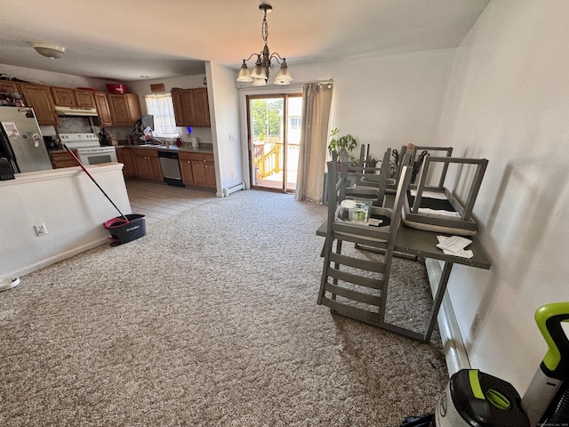71 Harold St, West Haven, CT 06516 - kitchen with appliances with stainless steel finishes, light carpet, brown cabinetry, pendant lighting, and under cabinet range hood