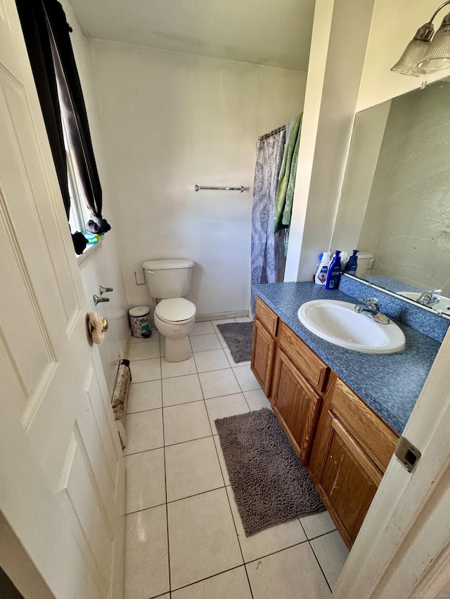 71 Harold St, West Haven, CT 06516 - bathroom with tile patterned floors, vanity, and a shower with shower curtain