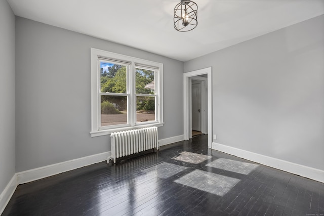 120 Monmouth Ave, Waterbury, CT 06704 - empty room featuring radiator and wood-type flooring