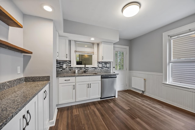120 Monmouth Ave, Waterbury, CT 06704 - kitchen with dishwasher, radiator, wainscoting, dark wood-style flooring, and white cabinets