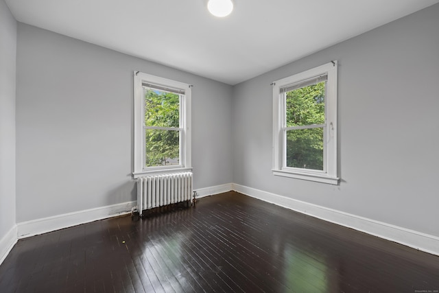 120 Monmouth Ave, Waterbury, CT 06704 - unfurnished room with radiator and dark wood finished floors