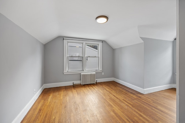 120 Monmouth Ave, Waterbury, CT 06704 - additional living space featuring radiator, vaulted ceiling, and light wood finished floors