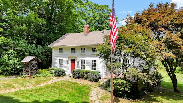 795 Rte 148, Killingworth, CT 06419 - colonial home with a front lawn, a chimney, and an outdoor structure