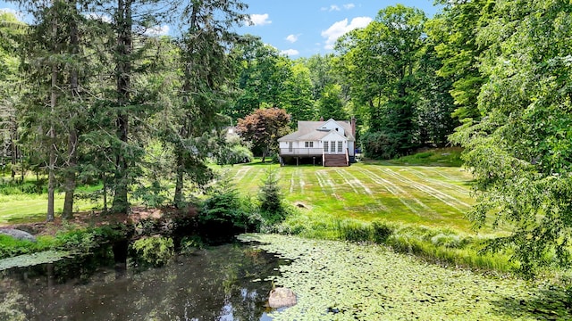 795 Rte 148, Killingworth, CT 06419 - view of green lawn with a wooden deck and a forest view