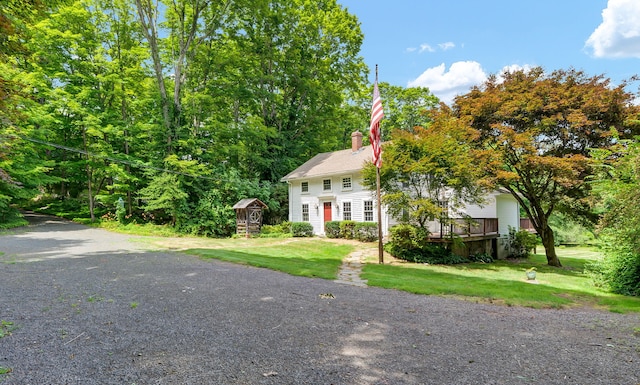795 Rte 148, Killingworth, CT 06419 - view of front of home with a front lawn, a chimney, and a deck