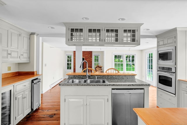 795 Rte 148, Killingworth, CT 06419 - kitchen featuring appliances with stainless steel finishes, beverage cooler, dark wood-type flooring, a kitchen island with sink, and recessed lighting