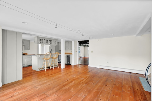 795 Rte 148, Killingworth, CT 06419 - unfurnished living room with a baseboard heating unit and light wood-type flooring