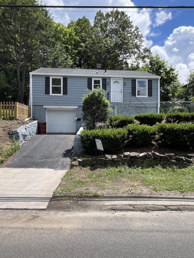 2308 N Main St, Waterbury, CT 06704 - view of front of home with an attached garage and asphalt driveway