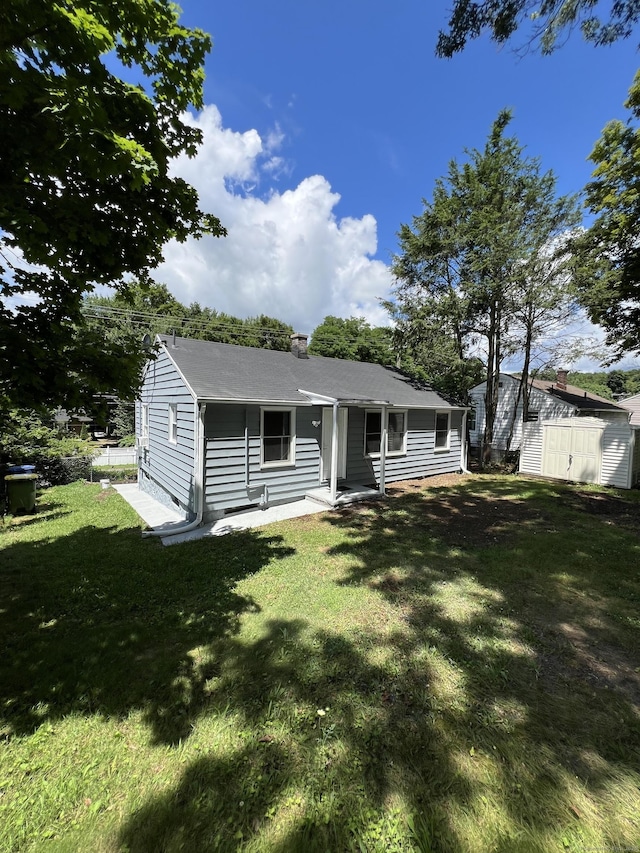 2308 N Main St, Waterbury, CT 06704 - view of front of property featuring a front lawn and a shed