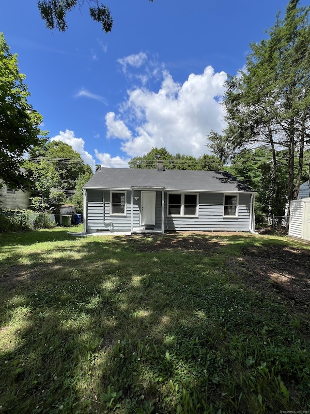 2308 N Main St, Waterbury, CT 06704 - view of front of home featuring a front lawn and a chimney