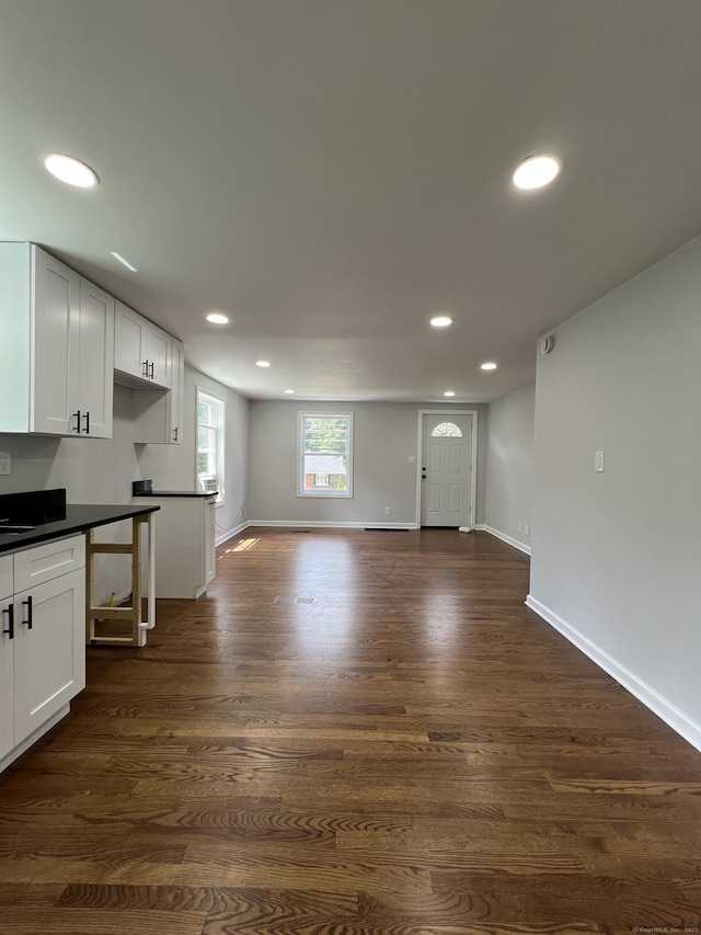 2308 N Main St, Waterbury, CT 06704 - unfurnished living room featuring recessed lighting and dark wood-type flooring