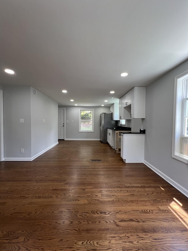2308 N Main St, Waterbury, CT 06704 - unfurnished living room featuring recessed lighting and dark wood-style flooring