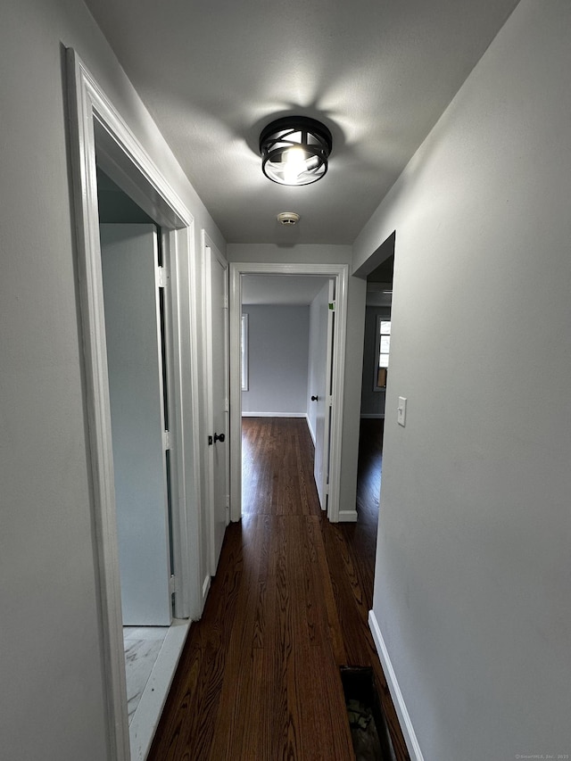 2308 N Main St, Waterbury, CT 06704 - hallway featuring dark wood finished floors and baseboards