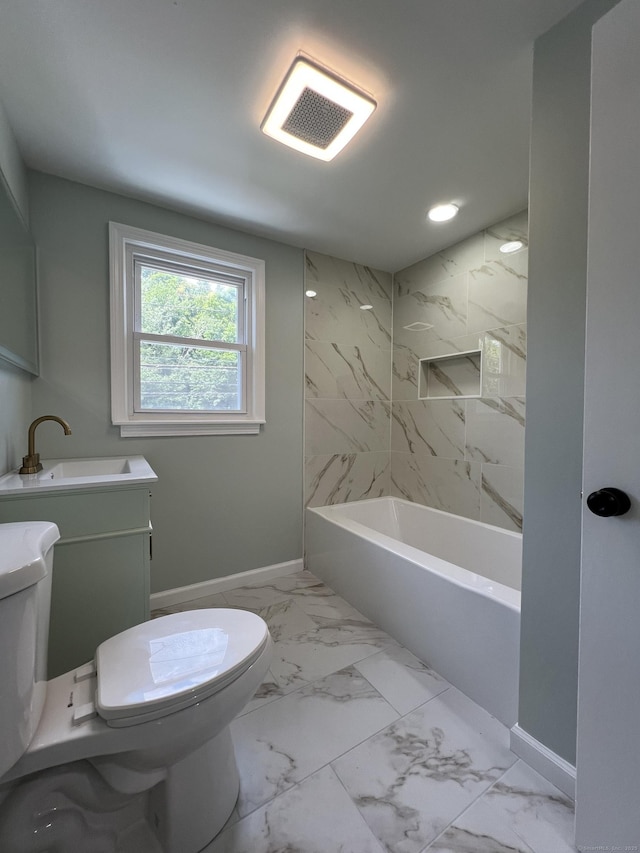 2308 N Main St, Waterbury, CT 06704 - bathroom with marble look tile flooring, vanity, and recessed lighting